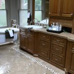 brown bathroom counter and cabinets