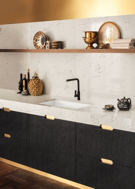 white marbled counter and black cabinets