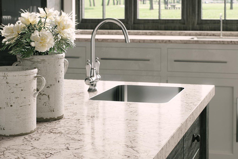 ivory and black counter with sink and white flowers