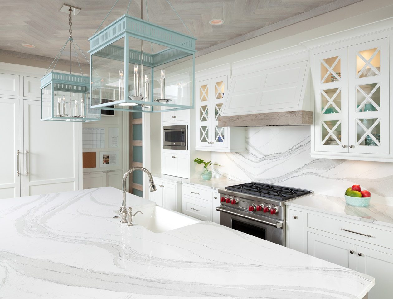 white kitchen with green lighting fixtures